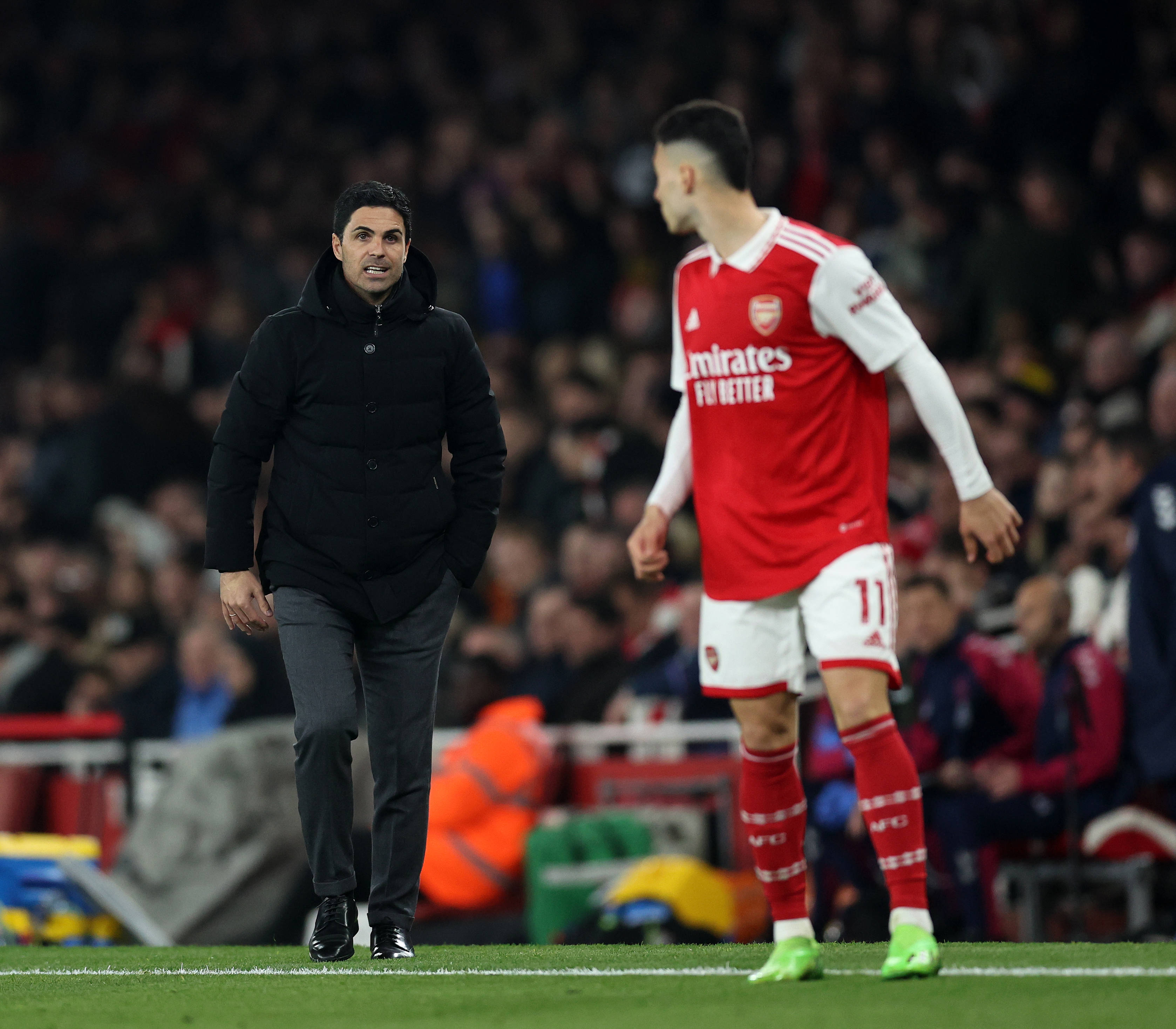 Mikel Arteta manager of Arsenal speaks to Gabriel Martinelli of Arsenal during the Premier League match at the Emirates Stadium