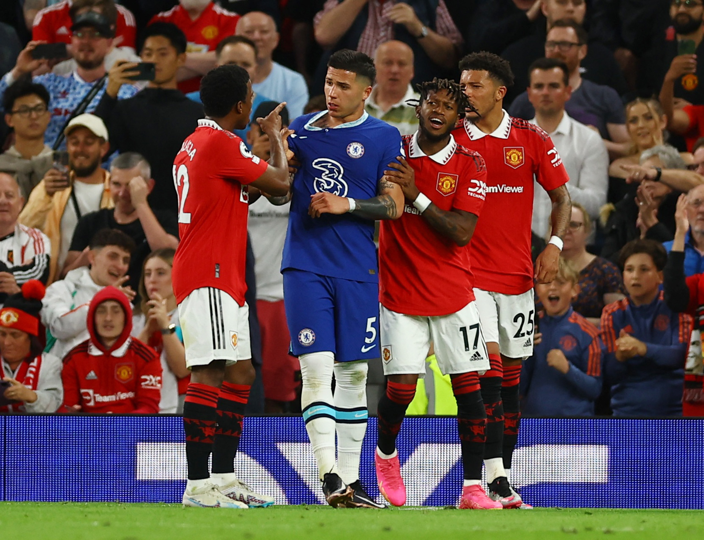 Manchester United's Tyrell Malacia clashes with Chelsea's Enzo Fernandez as Manchester United's Fred and Jadon Sancho react REUTERS/Molly Darlington