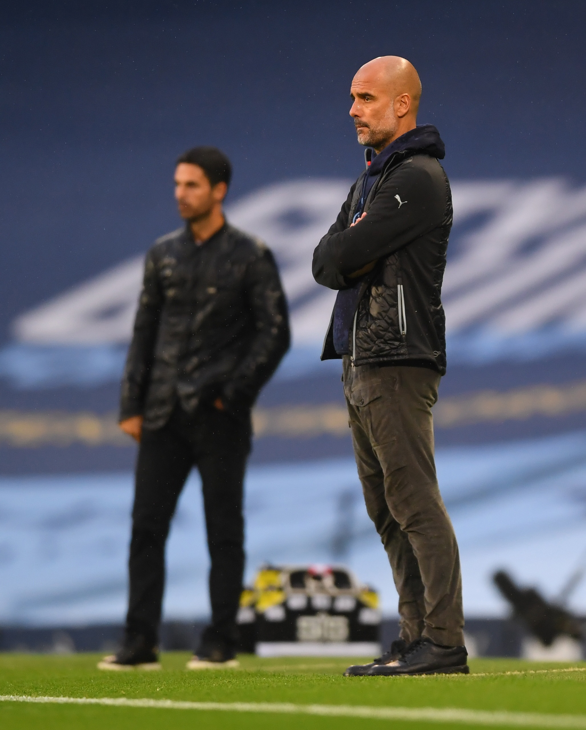 Mikel Arteta and Pep Guardiola/REUTERS