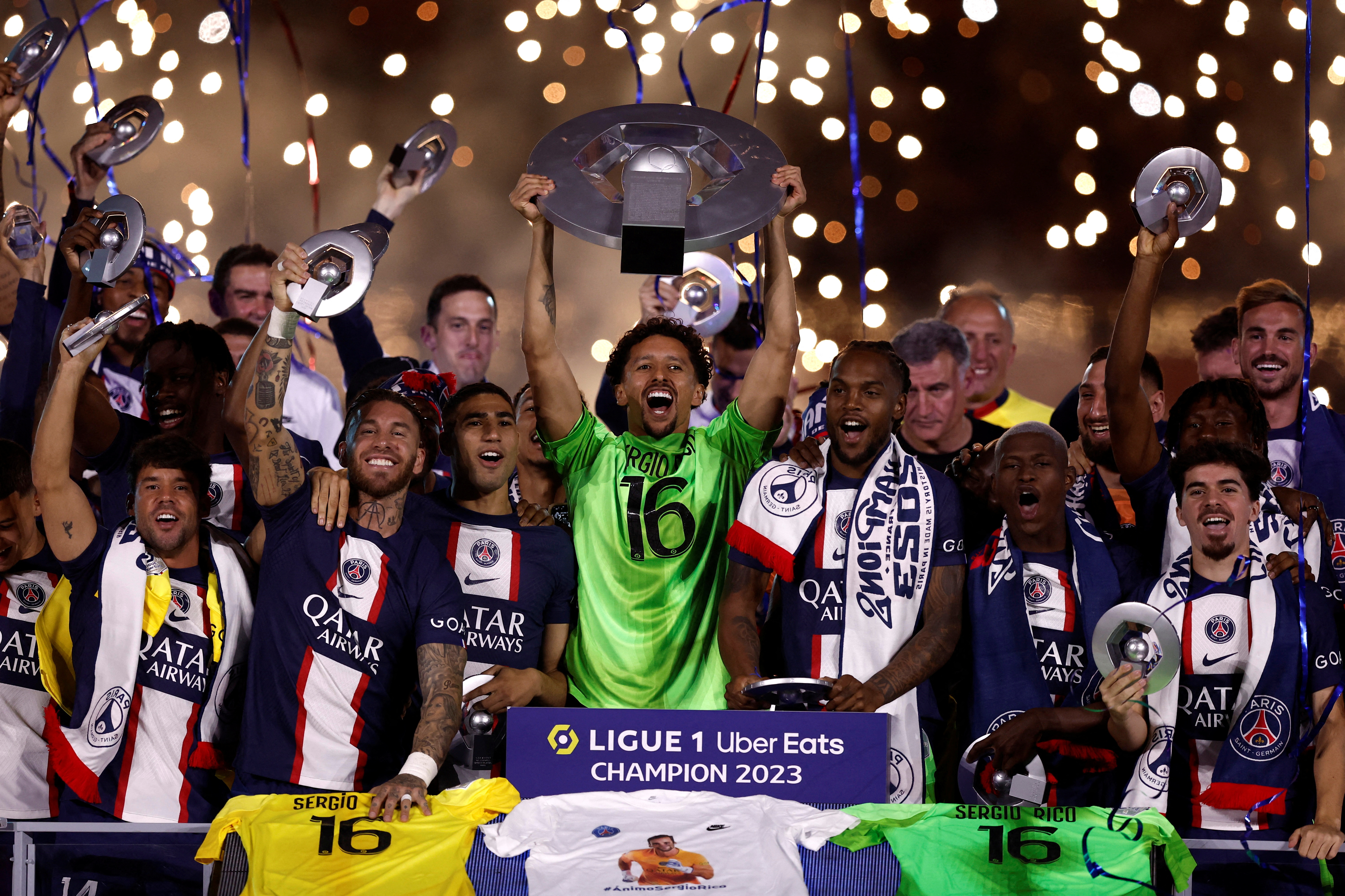 Paris St Germain's Marquinhos and teammates celebrate winning the Ligue 1 with the trophy REUTERS/Benoit Tessier